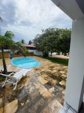 House on beach with pool.